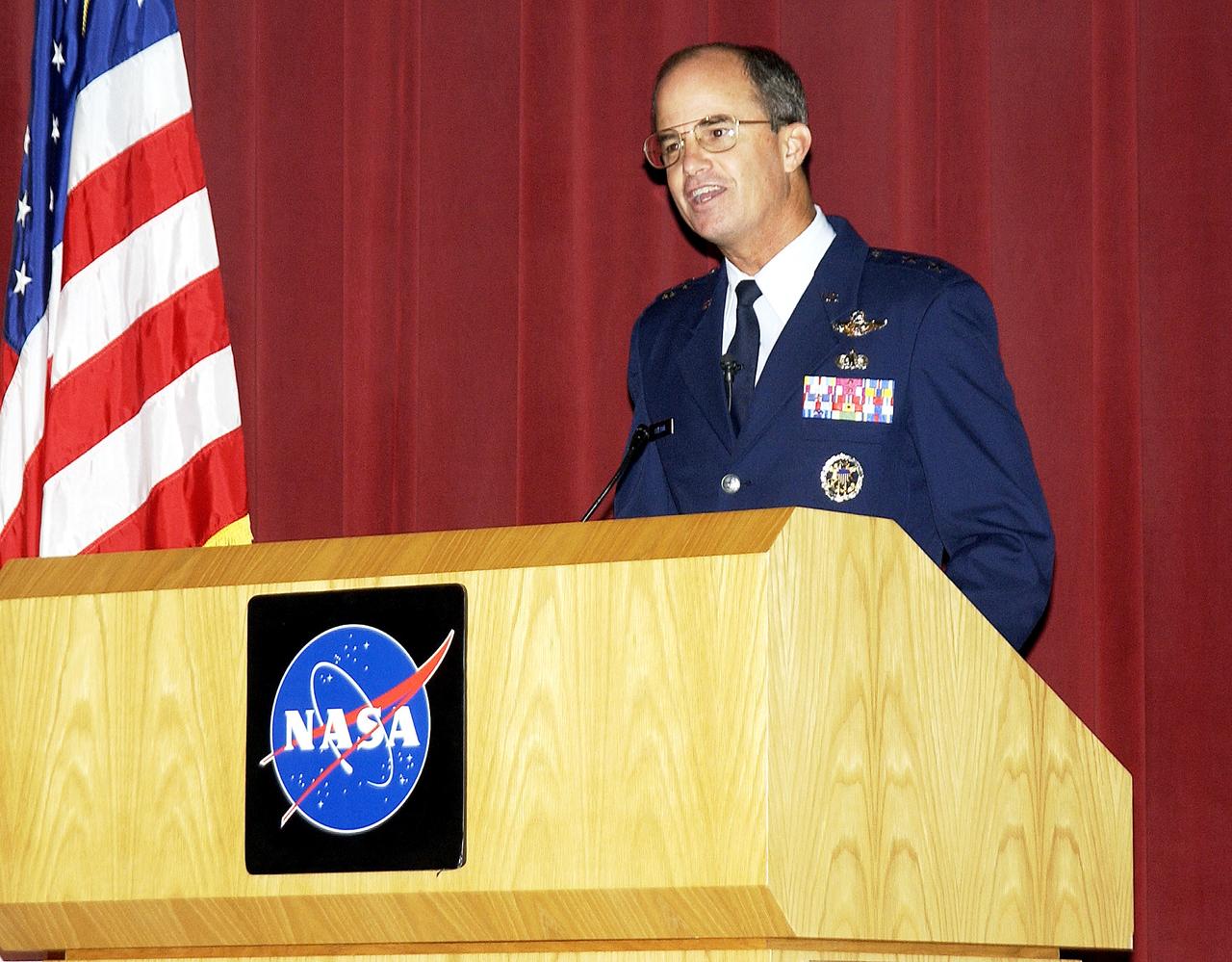 KENNEDY SPACE CENTER, FLA. - Maj. Gen. Kevin Chilton speaks to the employees and guests gathered in the KSC Training Auditorium for Spaceport Super Safety and Health Day.  The kickoff presentation also included speakers Brig. Gen. J. Gregory Pavlovich, 45th Space Wing, and Capt. Charles Plumb (USNR retired), who spoke about his experiences in the Navy and as a prisoner of war in Vietnam.  Spaceport Super Safety and Health Day is an annual event at KSC and Cape Canaveral Air Force Station dedicated to reinforcing safe and healthful behaviors in the workforce.  Safety Awards were also given to individuals and groups.