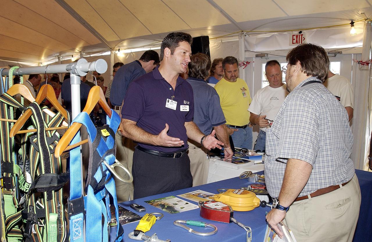 KENNEDY SPACE CENTER, FLA. - Employees file around table displays under a tent near the Vehicle Assembly Building.  Many vendors displayed their products during the Spaceport Super Safety and Health Day at KSC, an annual event dedicated to reinforcing safe and healthful behaviors in the workforce.