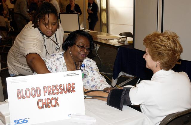 NASA image: KENNEDY SPACE CENTER, FLA. - An employee gets a blood pressure check from one of the participating organizations in Spaceport Super Safety and Health Day at KSC  and Cape Canaveral Air Force Station.  Many vendors and Center organizations displayed and demonstrated their products during the  annual event dedicated to reinforcing safe and healthful behaviors in the workforce.