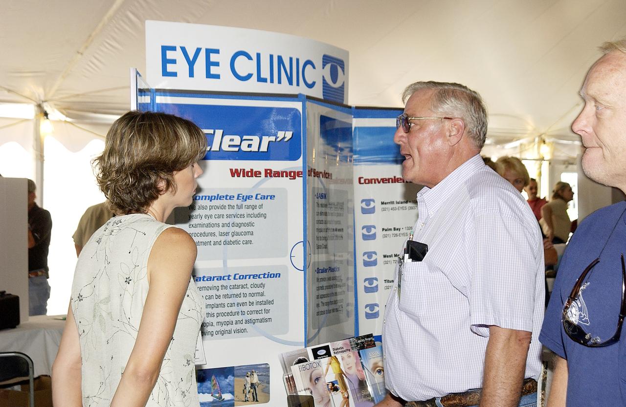 KENNEDY SPACE CENTER, FLA. - Employees file around table displays under a tent near the Operations and Checkout Building.  Many vendors and organizations displayed their products during the Spaceport Super Safety and Health Day at KSC and Cape Canaveral Air Force Station, an annual event dedicated to reinforcing safe and healthful behaviors in the workforce.