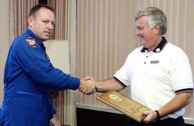 NASA image: KENNEDY SPACE CENTER, FLA. -   Astronaut Barry E. Wilmore (left) congratulates Center Director Jim Kennedy after presenting him with a special award for Spaceport Super Safety and Health Day.