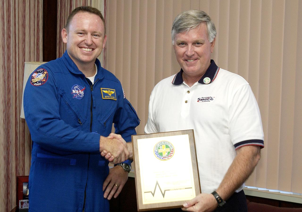 KENNEDY SPACE CENTER, FLA. -  Astronaut Barry E. Wilmore (left) and Center Director Jim Kennedy pose for a photo after Wilmore presented Kennedy with a special award for Spaceport Super Safety and Health Day.