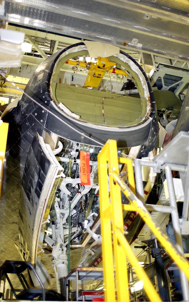 KENNEDY SPACE CENTER, FLA. - In the Orbiter Processing Facility, Atlantis is seen after its nose cap was removed for routine inspection. The nose cap is made of reinforced carbon-carbon (RCC), which has an operating range of minus 250° F to about 3,000° F.