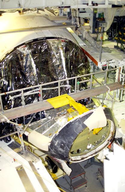 NASA image: KENNEDY SPACE CENTER, FLA. - In the Orbiter Processing Facility, Atlantis is seen after its nose cap was removed for routine inspection. The nose cap is made of reinforced carbon-carbon (RCC), which has an operating range of minus 250° F to about 3,000° F.