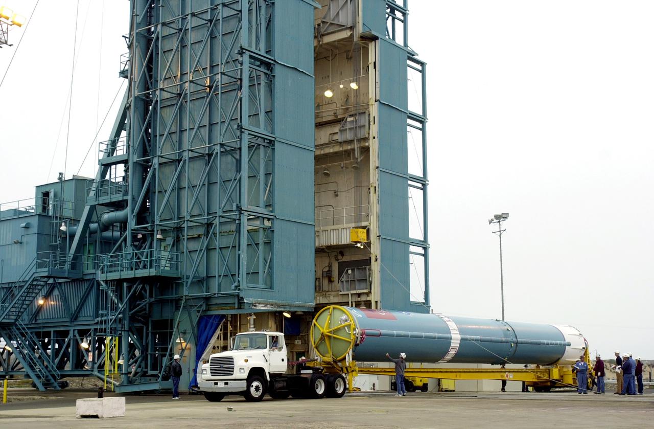 VANDENBERG AFB, CALIF. -  The first stage of the Delta II launch vehicle for the Gravity Probe B experiment arrives at Space Launch Complex 2, Vandenberg Air Force Base, Calif.  The Gravity Probe B will launch a payload of four gyroscopes into low-Earth polar orbit to test two extraordinary predictions of Albert Einstein’s general theory of relativity: the geodetic effect (how space and time are warped by the presence of the Earth) and frame dragging (how Earth’s rotation drags space and time around with it). Once in orbit, for 18 months each gyroscope’s spin axis will be monitored as it travels through local spacetime, observing and measuring these effects.  The experiment was developed by Stanford University, Lockheed Martin and NASA’s Marshall Space Flight Center.  The targeted launch date is Dec. 6, 2003.