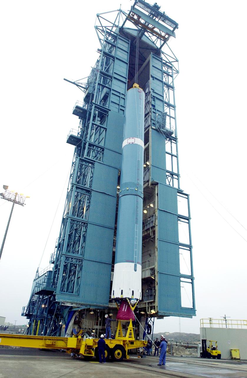 VANDENBERG AFB, CALIF. -  The first stage of the Delta II launch vehicle for the Gravity Probe B experiment is ready to be lifted up the mobile service tower on Space Launch Complex 2, Vandenberg Air Force Base, Calif.  The Gravity Probe B will launch a payload of four gyroscopes into low-Earth polar orbit to test two extraordinary predictions of Albert Einstein’s general theory of relativity: the geodetic effect (how space and time are warped by the presence of the Earth) and frame dragging (how Earth’s rotation drags space and time around with it). Once in orbit, for 18 months each gyroscope’s spin axis will be monitored as it travels through local spacetime, observing and measuring these effects.  The experiment was developed by Stanford University, Lockheed Martin and NASA’s Marshall Space Flight Center.  The targeted launch date is Dec. 6, 2003.