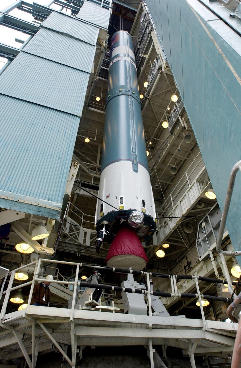 VANDENBERG AFB, CALIF. -   The first stage of the Delta II launch vehicle for the Gravity Probe B experiment is lifted up the mobile service tower on Space Launch Complex 2, Vandenberg Air Force Base, Calif.  The Gravity Probe B will launch a payload of four gyroscopes into low-Earth polar orbit to test two extraordinary predictions of Albert Einstein’s general theory of relativity: the geodetic effect (how space and time are warped by the presence of the Earth) and frame dragging (how Earth’s rotation drags space and time around with it). Once in orbit, for 18 months each gyroscope’s spin axis will be monitored as it travels through local spacetime, observing and measuring these effects.  The experiment was developed by Stanford University, Lockheed Martin and NASA’s Marshall Space Flight Center.  The targeted launch date is Dec. 6, 2003.