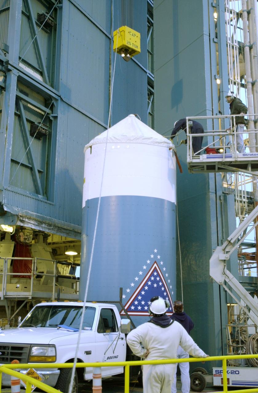 VANDENBERG AFB, CALIF. -  The interstage of the Delta II launch vehicle for the Gravity Probe B experiment is  prepared for lifting up the mobile service tower on Space Launch Complex 2, Vandenberg Air Force Base, Calif.  It will enclose the second stage.  The Gravity Probe B will launch a payload of four gyroscopes into low-Earth polar orbit to test two extraordinary predictions of Albert Einstein’s general theory of relativity: the geodetic effect (how space and time are warped by the presence of the Earth) and frame dragging (how Earth’s rotation drags space and time around with it). Once in orbit, for 18 months each gyroscope’s spin axis will be monitored as it travels through local spacetime, observing and measuring these effects.  The experiment was developed by Stanford University, Lockheed Martin and NASA’s Marshall Space Flight Center.  The targeted launch date is Dec. 6, 2003.