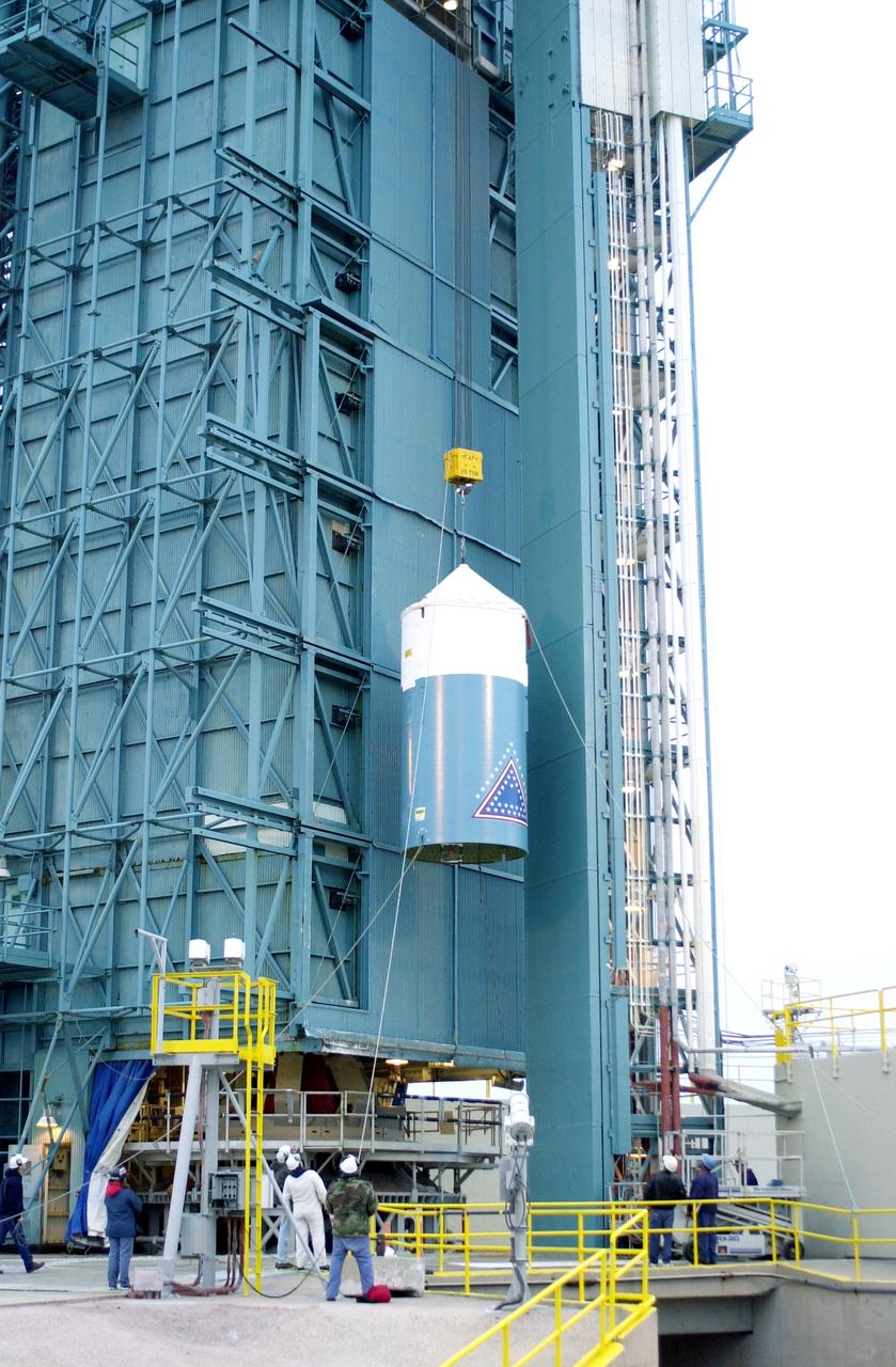 VANDENBERG AFB, CALIF. -  The interstage of the Delta II launch vehicle for the Gravity Probe B experiment is lifted up the mobile service tower on Space Launch Complex 2, Vandenberg Air Force Base, Calif.  It will enclose the second stage.  The Gravity Probe B will launch a payload of four gyroscopes into low-Earth polar orbit to test two extraordinary predictions of Albert Einstein’s general theory of relativity: the geodetic effect (how space and time are warped by the presence of the Earth) and frame dragging (how Earth’s rotation drags space and time around with it). Once in orbit, for 18 months each gyroscope’s spin axis will be monitored as it travels through local spacetime, observing and measuring these effects.  The experiment was developed by Stanford University, Lockheed Martin and NASA’s Marshall Space Flight Center.  The targeted launch date is Dec. 6, 2003.