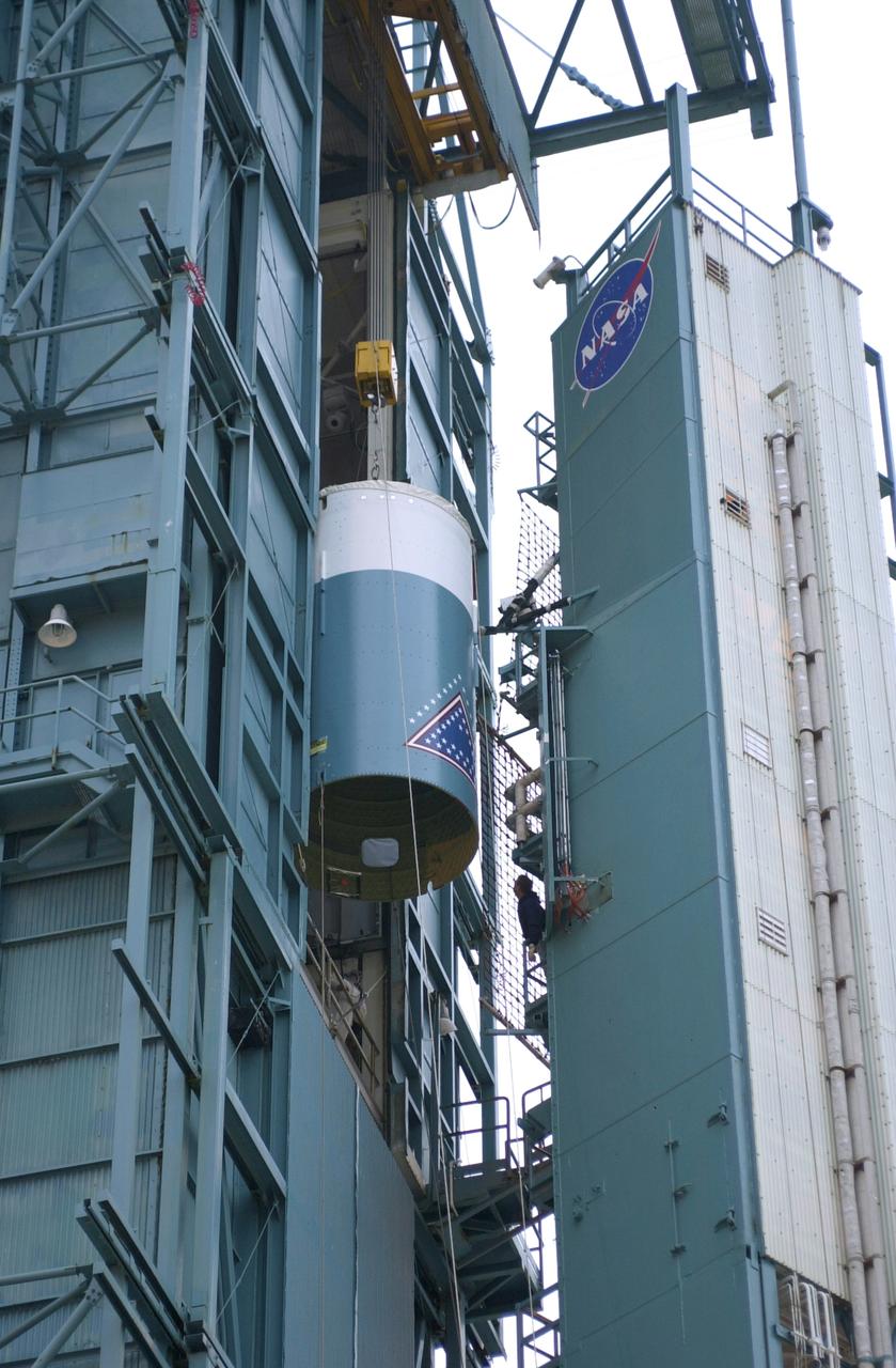 VANDENBERG AFB, CALIF. -   The interstage of the Delta II launch vehicle for the Gravity Probe B experiment is moved into the mobile service tower on Space Launch Complex 2, Vandenberg Air Force Base, Calif., where it will be mated with the second stage.  The Gravity Probe B will launch a payload of four gyroscopes into low-Earth polar orbit to test two extraordinary predictions of Albert Einstein’s general theory of relativity: the geodetic effect (how space and time are warped by the presence of the Earth) and frame dragging (how Earth’s rotation drags space and time around with it). Once in orbit, for 18 months each gyroscope’s spin axis will be monitored as it travels through local spacetime, observing and measuring these effects.  The experiment was developed by Stanford University, Lockheed Martin and NASA’s Marshall Space Flight Center.  The targeted launch date is Dec. 6, 2003.