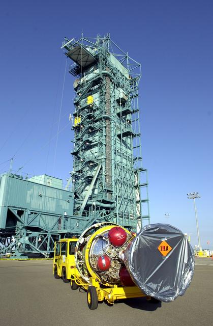 NASA image: VANDENBERG AFB, CALIF. -  The second stage of the Delta II launch vehicle for the Gravity Probe B experiment arrives at the mobile service tower on Space Launch Complex 2, Vandenberg Air Force Base, Calif.  The Gravity Probe B will launch a payload of four gyroscopes into low-Earth polar orbit to test two extraordinary predictions of Albert Einstein’s general theory of relativity: the geodetic effect (how space and time are warped by the presence of the Earth) and frame dragging (how Earth’s rotation drags space and time around with it). Once in orbit, for 18 months each gyroscope’s spin axis will be monitored as it travels through local spacetime, observing and measuring these effects.  The experiment was developed by Stanford University, Lockheed Martin and NASA’s Marshall Space Flight Center.  The targeted launch date is Dec. 6, 2003.