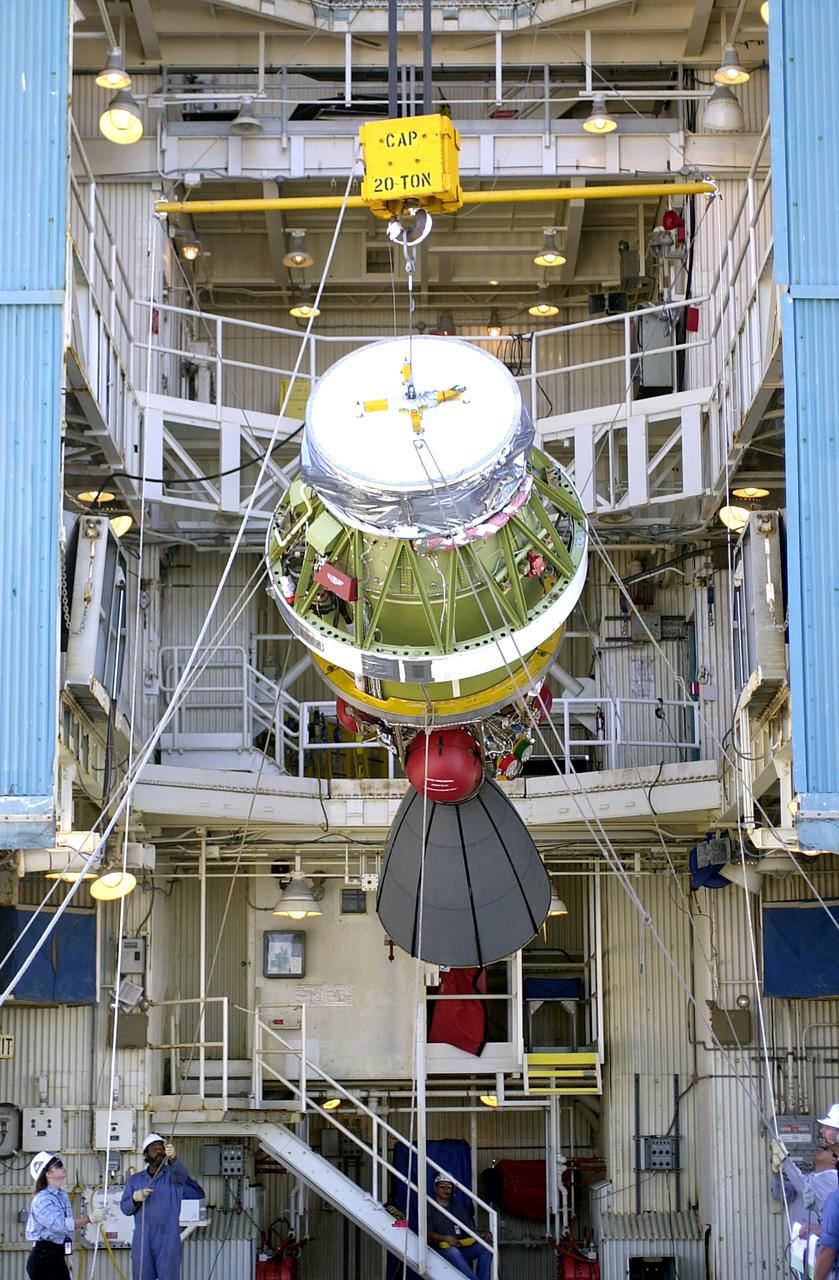 VANDENBERG AFB, CALIF. -  The second stage of the Delta II launch vehicle for the Gravity Probe B experiment is lifted up the mobile service tower on Space Launch Complex 2, Vandenberg Air Force Base, Calif.  The Gravity Probe B will launch a payload of four gyroscopes into low-Earth polar orbit to test two extraordinary predictions of Albert Einstein’s general theory of relativity: the geodetic effect (how space and time are warped by the presence of the Earth) and frame dragging (how Earth’s rotation drags space and time around with it). Once in orbit, for 18 months each gyroscope’s spin axis will be monitored as it travels through local spacetime, observing and measuring these effects.  The experiment was developed by Stanford University, Lockheed Martin and NASA’s Marshall Space Flight Center.  The targeted launch date is Dec. 6, 2003.