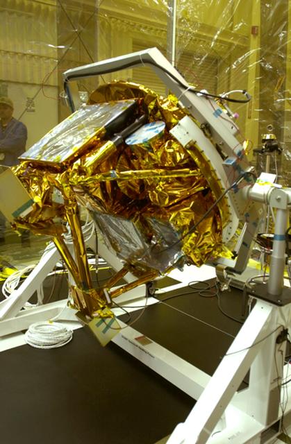 NASA image: VANDENBERG AIR FORCE BASE, CALIF.- At Vandenberg Air Force Base, Calif., spacecraft functional testing is underway on the SciSat-1. The solar arrays are being attached and the communications systems are also being checked out.   The SciSat-1 weighs approximately 330 pounds and after launch will be placed in a 400-mile-high polar orbit to investigate processes that control the distribution of ozone in the upper atmosphere. The data from the satellite will provide Canadian and international scientists with improved measurements relating to global ozone processes and help policymakers assess existing environmental policy and develop protective measures for improving the health of our atmosphere, preventing further ozone depletion. The mission is designed to last two years.