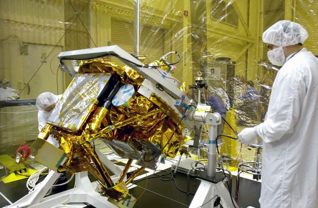 NASA image: VANDENBERG AIR FORCE BASE, CALIF.- At Vandenberg Air Force Base, Calif., spacecraft functional testing is underway on the SciSat-1. The solar arrays are being attached and the communications systems are also being checked out.   The SciSat-1 weighs approximately 330 pounds and after launch will be placed in a 400-mile-high polar orbit to investigate processes that control the distribution of ozone in the upper atmosphere. The data from the satellite will provide Canadian and international scientists with improved measurements relating to global ozone processes and help policymakers assess existing environmental policy and develop protective measures for improving the health of our atmosphere, preventing further ozone depletion. The mission is designed to last two years.