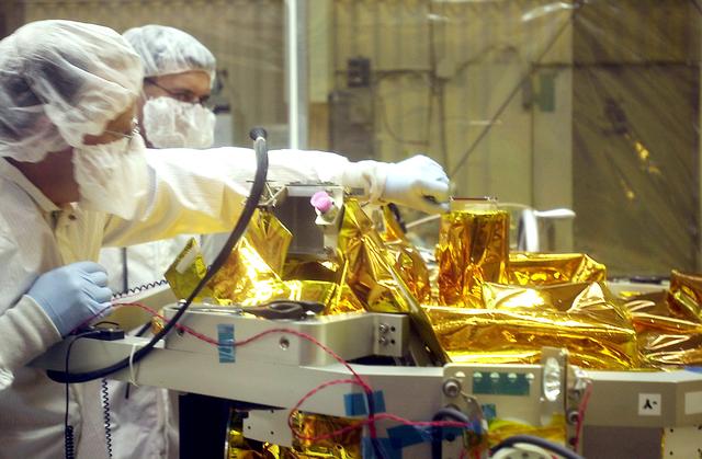 NASA image: VANDENBERG AIR FORCE BASE, CALIF.- At Vandenberg Air Force Base, Calif., spacecraft functional testing is underway on the SciSat-1. The solar arrays are being attached and the communications systems are also being checked out.   The SciSat-1 weighs approximately 330 pounds and after launch will be placed in a 400-mile-high polar orbit to investigate processes that control the distribution of ozone in the upper atmosphere. The data from the satellite will provide Canadian and international scientists with improved measurements relating to global ozone processes and help policymakers assess existing environmental policy and develop protective measures for improving the health of our atmosphere, preventing further ozone depletion. The mission is designed to last two years.