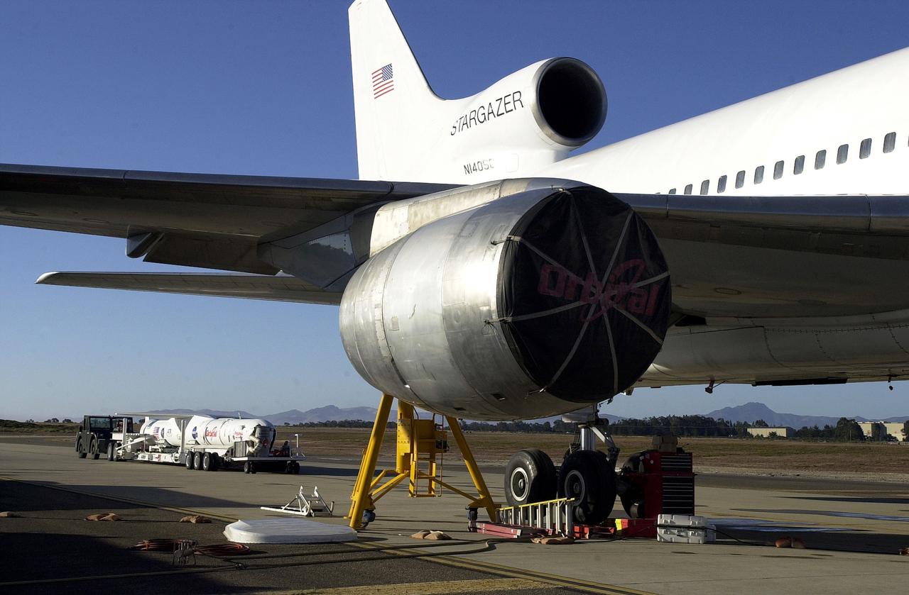 VANDENBERG AIR FORCE BASE, CALIF. - The SciSat-1 payload, with fairing installed and attached to its Pegasus launch vehicle, arrives at the pad for mating to the L-1011 carrier aircraft.  The SciSat-1 weighs approximately 330 pounds and after launch will be placed in a 400-mile-high polar orbit to investigate processes that control the distribution of ozone in the upper atmosphere. The data from the satellite will provide Canadian and international scientists with improved measurements relating to global ozone processes and help policymakers assess existing environmental policy and develop protective measures for improving the health of our atmosphere, preventing further ozone depletion. The mission is designed to last two years.