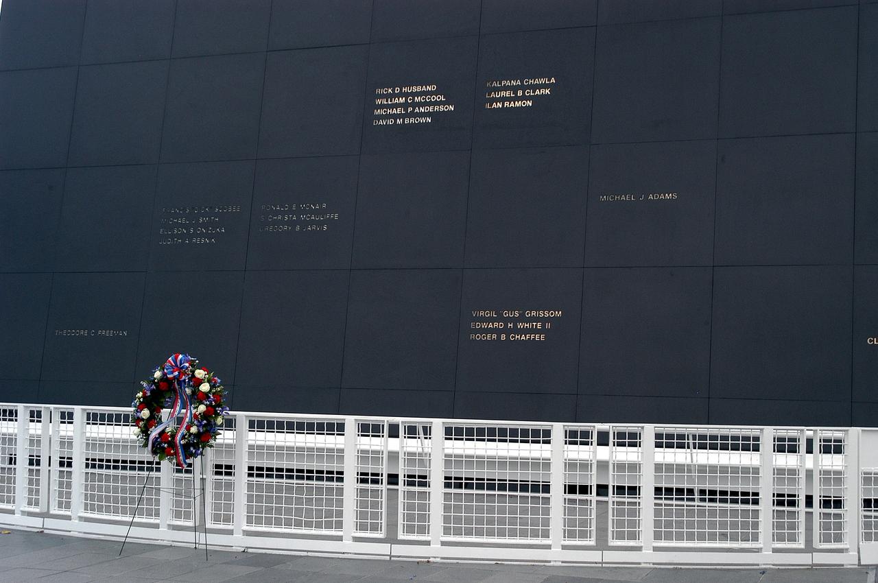 KENNEDY SPACE CENTER, FLA. -  A ceremonial wreath is placed at the Space Mirror Memorial at the Kennedy Space Center Visitor Complex.  During this dedication ceremony, the names of the STS-107 astronauts who lost their lives during the Columbia accident -- Rick Husband, Willie McCool, Laurel Clark, Michael Anderson, David Brown, Kalpana Chawla, and Ilan Ramon -- join the names of 17 other space heroes who gave their lives for the U.S. space program. The "Space Mirror," 42 1/2 feet high by 50 feet wide, illuminates the names of the fallen astronauts cut through the monument's black granite surface.