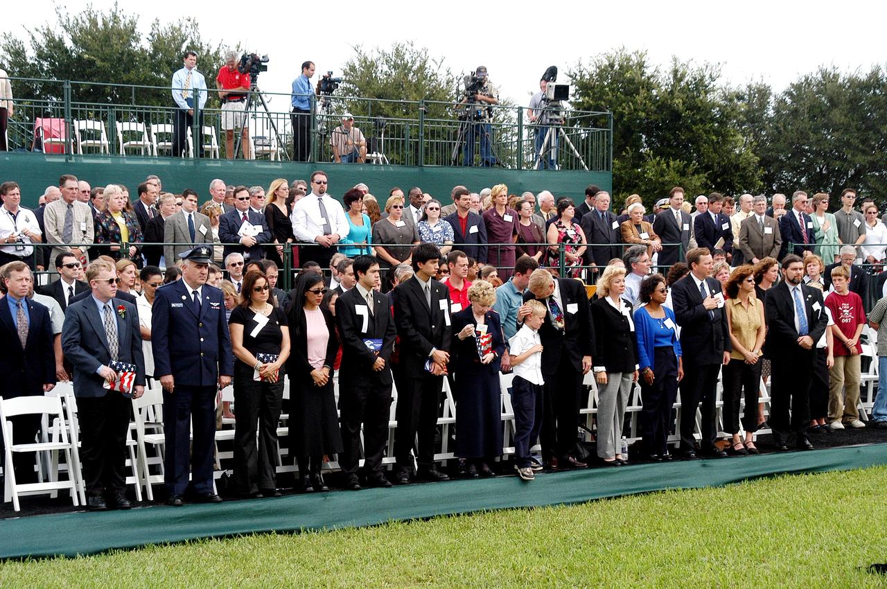 KENNEDY SPACE CENTER, FLA. -  Family members of the STS-107 astronauts and other dignitaries attend a dedication ceremony at the Space Mirror Memorial at the Kennedy Space Center Visitor Complex.  During this solemn event, the names of the STS-107 astronauts who lost their lives during the Columbia accident -- Rick Husband, Willie McCool, Laurel Clark, Michael Anderson, David Brown, Kalpana Chawla, and Ilan Ramon -- join the names of 17 other space heroes who gave their lives for the U.S. space program. The "Space Mirror," 42 1/2 feet high by 50 feet wide, illuminates the names of the fallen astronauts cut through the monument's black granite surface.