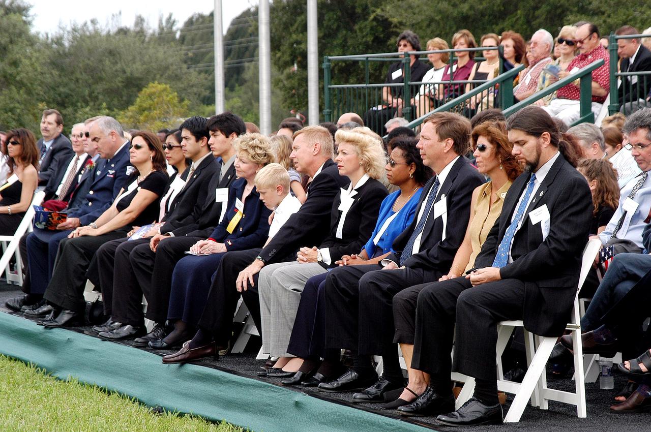 KENNEDY SPACE CENTER, FLA. -  Family members of the STS-107 astronauts and other dignitaries attend a dedication ceremony at the Space Mirror Memorial at the Kennedy Space Center Visitor Complex.  During this solemn event, the names of the STS-107 astronauts who lost their lives during the Columbia accident -- Rick Husband, Willie McCool, Laurel Clark, Michael Anderson, David Brown, Kalpana Chawla, and Ilan Ramon -- join the names of 17 other space heroes who gave their lives for the U.S. space program. The "Space Mirror," 42 1/2 feet high by 50 feet wide, illuminates the names of the fallen astronauts cut through the monument's black granite surface.