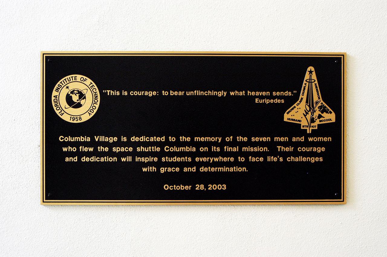 KENNEDY SPACE CENTER, FLA. -  A plaque dedicating the Columbia Village at the Florida Institute of Technology in Melbourne, Fla., is unveiled at a ceremony attended by family members of the STS-107 astronauts and other dignitaries.  Each of the seven new residence halls in the complex is named for one of the STS-107 astronauts who perished during the Columbia accident -- Rick Husband, Willie McCool, Laurel Clark, Michael Anderson, David Brown, Kalpana Chawla, and Ilan Ramon.
