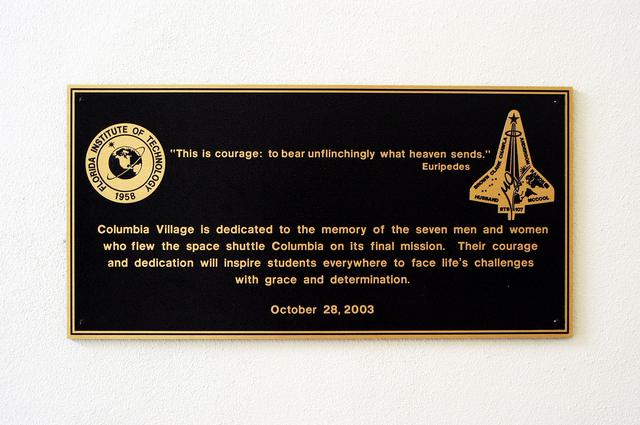 NASA image: KENNEDY SPACE CENTER, FLA. -  A plaque dedicating the Columbia Village at the Florida Institute of Technology in Melbourne, Fla., is unveiled at a ceremony attended by family members of the STS-107 astronauts and other dignitaries.  Each of the seven new residence halls in the complex is named for one of the STS-107 astronauts who perished during the Columbia accident -- Rick Husband, Willie McCool, Laurel Clark, Michael Anderson, David Brown, Kalpana Chawla, and Ilan Ramon.