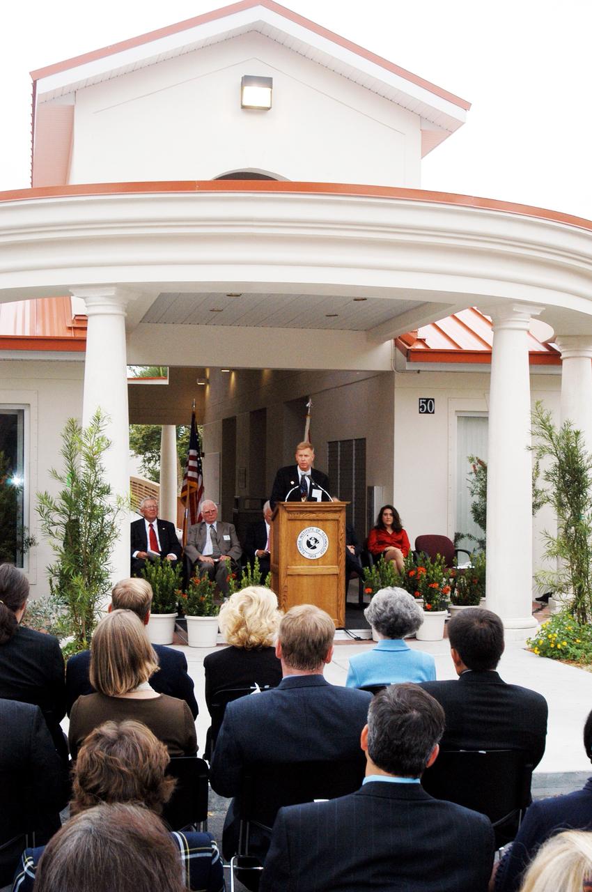 KENNEDY SPACE CENTER, FLA. -- Dr. Jonathan Clark, husband of STS-107 astronaut Laurel Clark, addresses the family members of the STS-107 astronauts, other dignitaries, members of the university community and the public gathered for the dedication ceremony of the Columbia Village at the Florida Institute of Technology in Melbourne, Fla.  Each of the seven new residence halls in the complex is named for one of the STS-107 astronauts who perished during the Columbia accident -- Rick Husband, Willie McCool, Laurel Clark, Michael Anderson, David Brown, Kalpana Chawla, and Ilan Ramon.