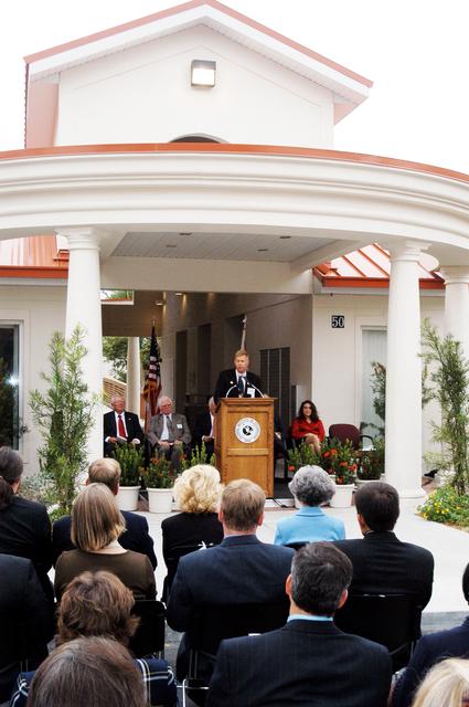 NASA image: KENNEDY SPACE CENTER, FLA. -- Dr. Jonathan Clark, husband of STS-107 astronaut Laurel Clark, addresses the family members of the STS-107 astronauts, other dignitaries, members of the university community and the public gathered for the dedication ceremony of the Columbia Village at the Florida Institute of Technology in Melbourne, Fla.  Each of the seven new residence halls in the complex is named for one of the STS-107 astronauts who perished during the Columbia accident -- Rick Husband, Willie McCool, Laurel Clark, Michael Anderson, David Brown, Kalpana Chawla, and Ilan Ramon.