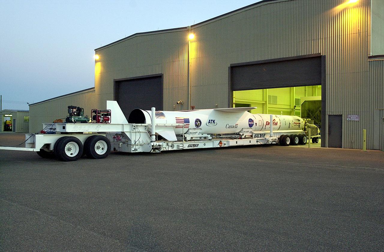 VANDENBERG AIR FORCE BASE, CALIF. -   The SciSat-1 payload, with fairing installed and attached to its Pegasus launch vehicle, begins rollout to the hot pad and mating to the L-1011 carrier aircraft.  The SciSat-1 weighs approximately 330 pounds and after launch will be placed in a 400-mile-high polar orbit to investigate processes that control the distribution of ozone in the upper atmosphere. The data from the satellite will provide Canadian and international scientists with improved measurements relating to global ozone processes and help policymakers assess existing environmental policy and develop protective measures for improving the health of our atmosphere, preventing further ozone depletion. The mission is designed to last two years.