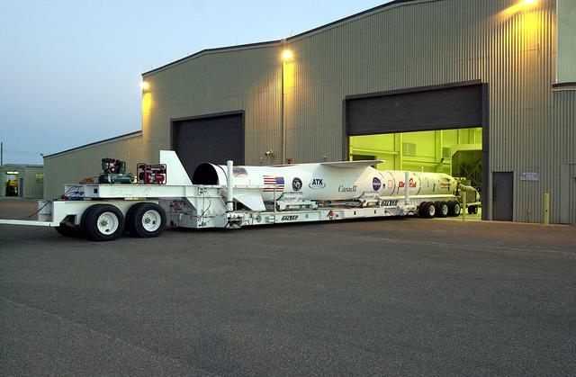 NASA image: VANDENBERG AIR FORCE BASE, CALIF. -   The SciSat-1 payload, with fairing installed and attached to its Pegasus launch vehicle, begins rollout to the hot pad and mating to the L-1011 carrier aircraft.  The SciSat-1 weighs approximately 330 pounds and after launch will be placed in a 400-mile-high polar orbit to investigate processes that control the distribution of ozone in the upper atmosphere. The data from the satellite will provide Canadian and international scientists with improved measurements relating to global ozone processes and help policymakers assess existing environmental policy and develop protective measures for improving the health of our atmosphere, preventing further ozone depletion. The mission is designed to last two years.