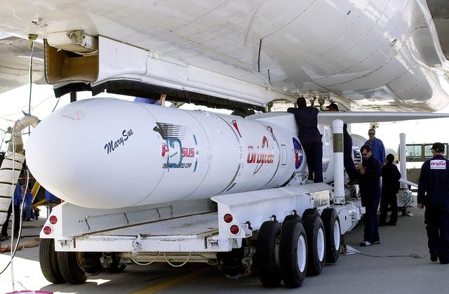 NASA image: VANDENBERG AIR FORCE BASE, CALIF. -    Workers mate the Pegasus , with its cargo of the SciSat-1 payload to the L-1011 carrier aircraft.  The SciSat-1 weighs approximately 330 pounds and after launch will be placed in a 400-mile-high polar orbit to investigate processes that control the distribution of ozone in the upper atmosphere. The data from the satellite will provide Canadian and international scientists with improved measurements relating to global ozone processes and help policymakers assess existing environmental policy and develop protective measures for improving the health of our atmosphere, preventing further ozone depletion. The mission is designed to last two years.