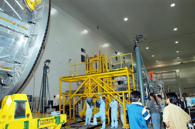 NASA image: KENNEDY SPACE CENTER, FLA. -  The Japanese Experiment Module (JEM) is moved on its workstand in the Space Station Processing Facility.  The JEM will undergo pre-assembly measurements.  Developed by the Japan Aerospace Exploration Agency (JAXA), the JEM will enhance the unique research capabilities of the orbiting complex by providing an additional environment for astronauts to conduct science experiments.