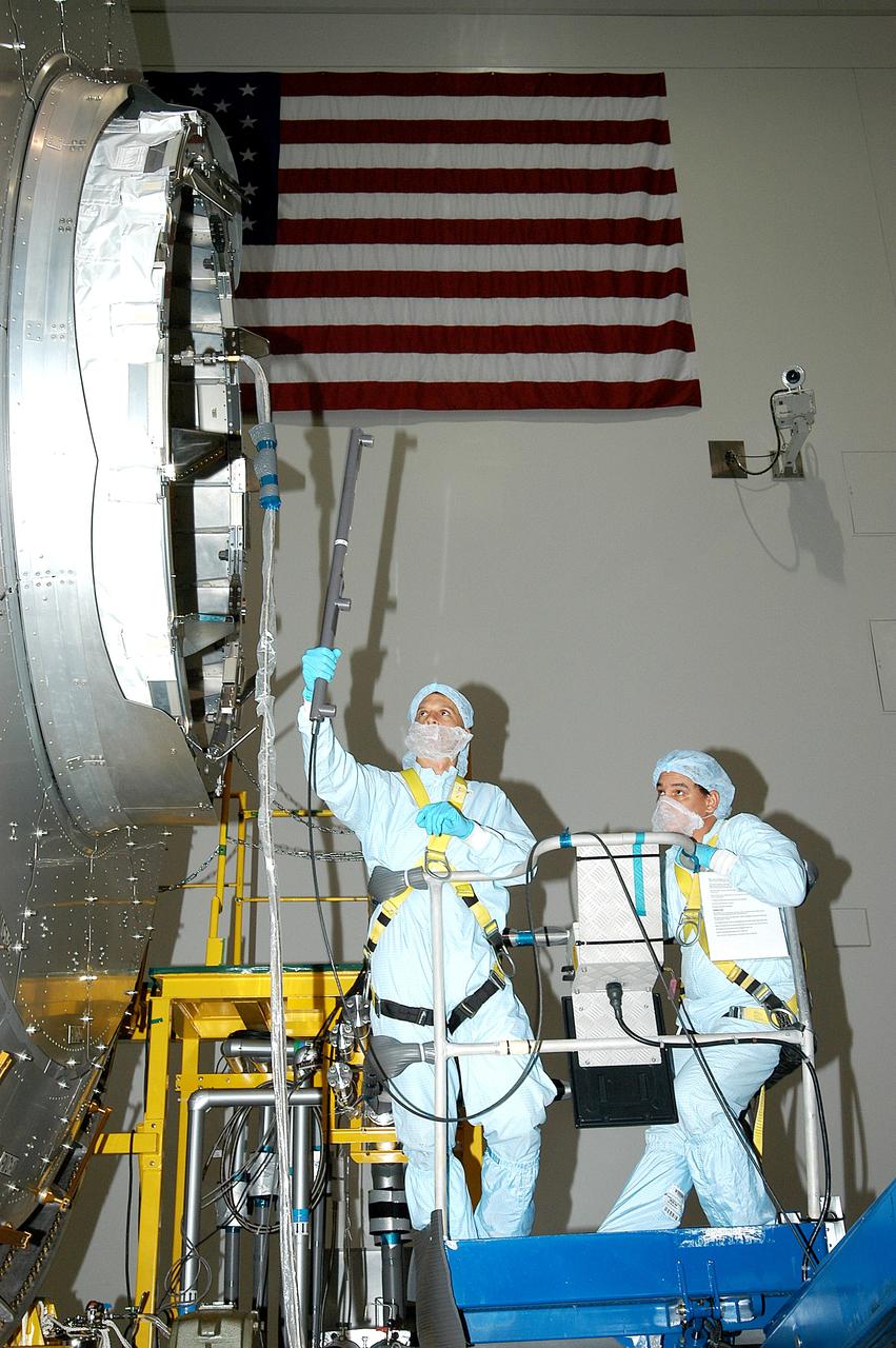 KENNEDY SPACE CENTER, FLA. -  In the Space Station Processing Facility, technicians begin pre-assembly measurements on the Japanese Experiment Module (JEM).  Developed by the Japan Aerospace Exploration Agency (JAXA), the JEM will enhance the unique research capabilities of the orbiting complex by providing an additional environment for astronauts to conduct science experiments.