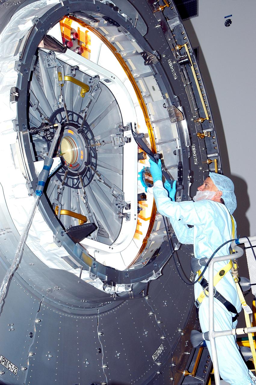 KENNEDY SPACE CENTER, FLA. - In the Space Station Processing Facility, a technician takes readings for pre-assembly measurements on the Japanese Experiment Module (JEM).  Developed by the Japan Aerospace Exploration Agency (JAXA), the JEM will enhance the unique research capabilities of the orbiting complex by providing an additional environment for astronauts to conduct science experiments.