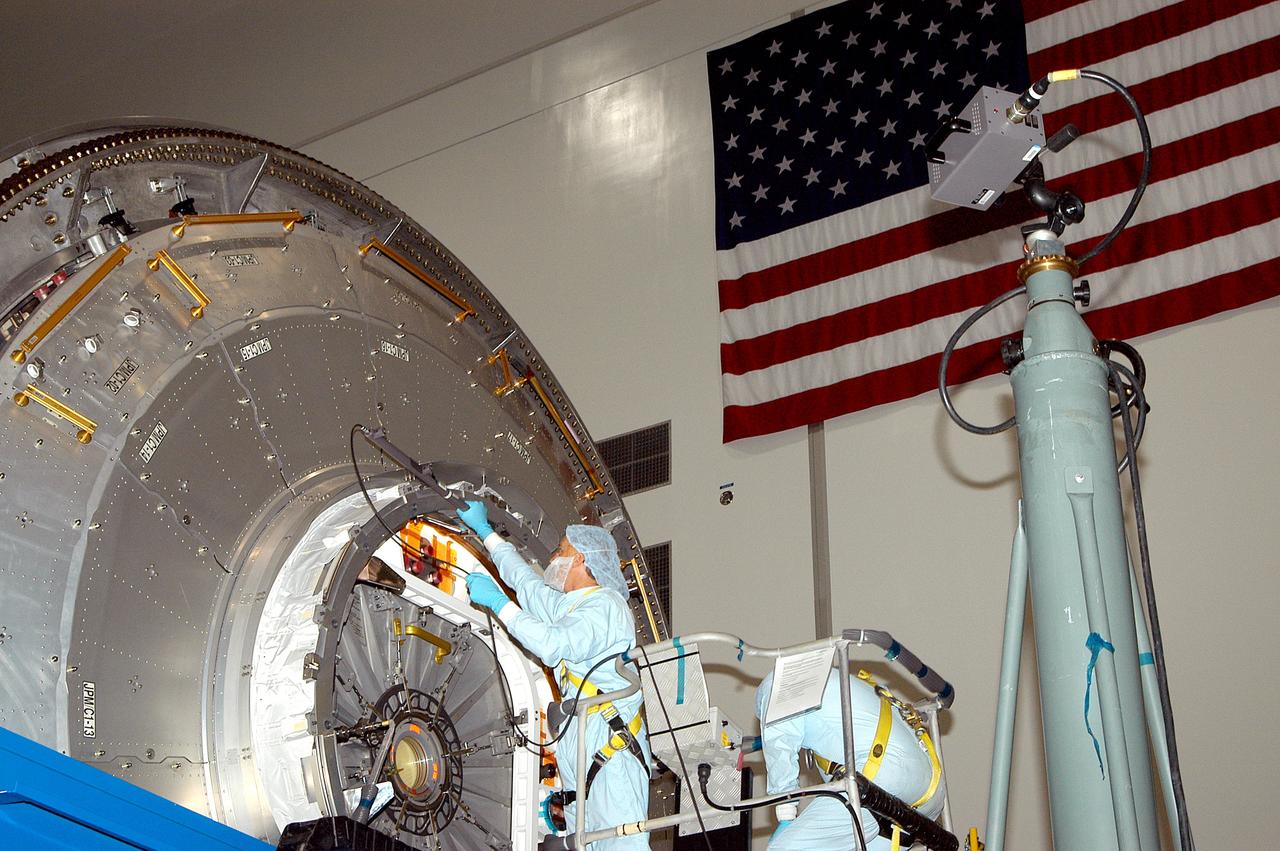 KENNEDY SPACE CENTER, FLA. - In the Space Station Processing Facility, a technician takes readings for pre-assembly measurements on the Japanese Experiment Module (JEM).  Developed by the Japan Aerospace Exploration Agency (JAXA), the JEM will enhance the unique research capabilities of the orbiting complex by providing an additional environment for astronauts to conduct science experiments.