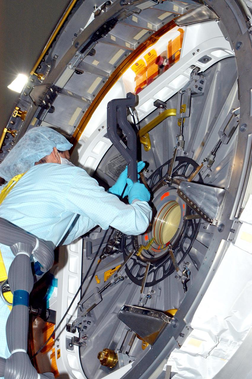 KENNEDY SPACE CENTER, FLA. - In the Space Station Processing Facility, a technician takes readings for pre-assembly measurements on the Japanese Experiment Module (JEM).  Developed by the Japan Aerospace Exploration Agency (JAXA), the JEM will enhance the unique research capabilities of the orbiting complex by providing an additional environment for astronauts to conduct science experiments.