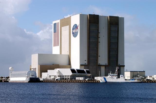 NASA image: KENNEDY SPACE CENTER, FLA. -  The Freedom Star is berthed at the Turn Basin near the Vehicle Assembly Building.  The ship has recently returned to KSC after refurbishment at Fort George Island, Fla., including new paint.  Freedom Star is one of the solid rocket booster (SRB) retrieval ships built to recover the SRB casings released over the Atlantic Ocean after launch of a Space Shuttle.  In addition to the SRBs, the ship recovers the drogue and main parachutes that slow the boosters’ speed before splashdown.  Some of the retrieval equipment can be seen on the rear deck.  The ships also tow the external tanks built at the Michoud Space Systems Assembly Facility near New Orleans to Port Canaveral, Fla.  Freedom Star was brought to KSC today for a visit by NATO Parliamentarians.