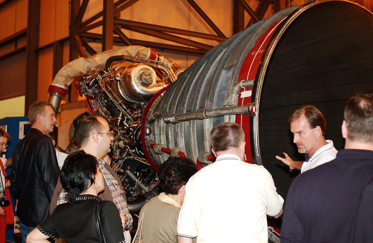 KENNEDY SPACE CENTER, FLA. - Members of the North American Treaty Organization (NATO) Parliamentary Assembly  get a close look at a Space Shuttle main engine in the Vehicle Assembly Building during their tour of KSC.   The Parliamentarians are meeting in Orlando this year for their 49th annual gathering.  They chose to visit KSC with their families during their one-day excursion break from meetings.