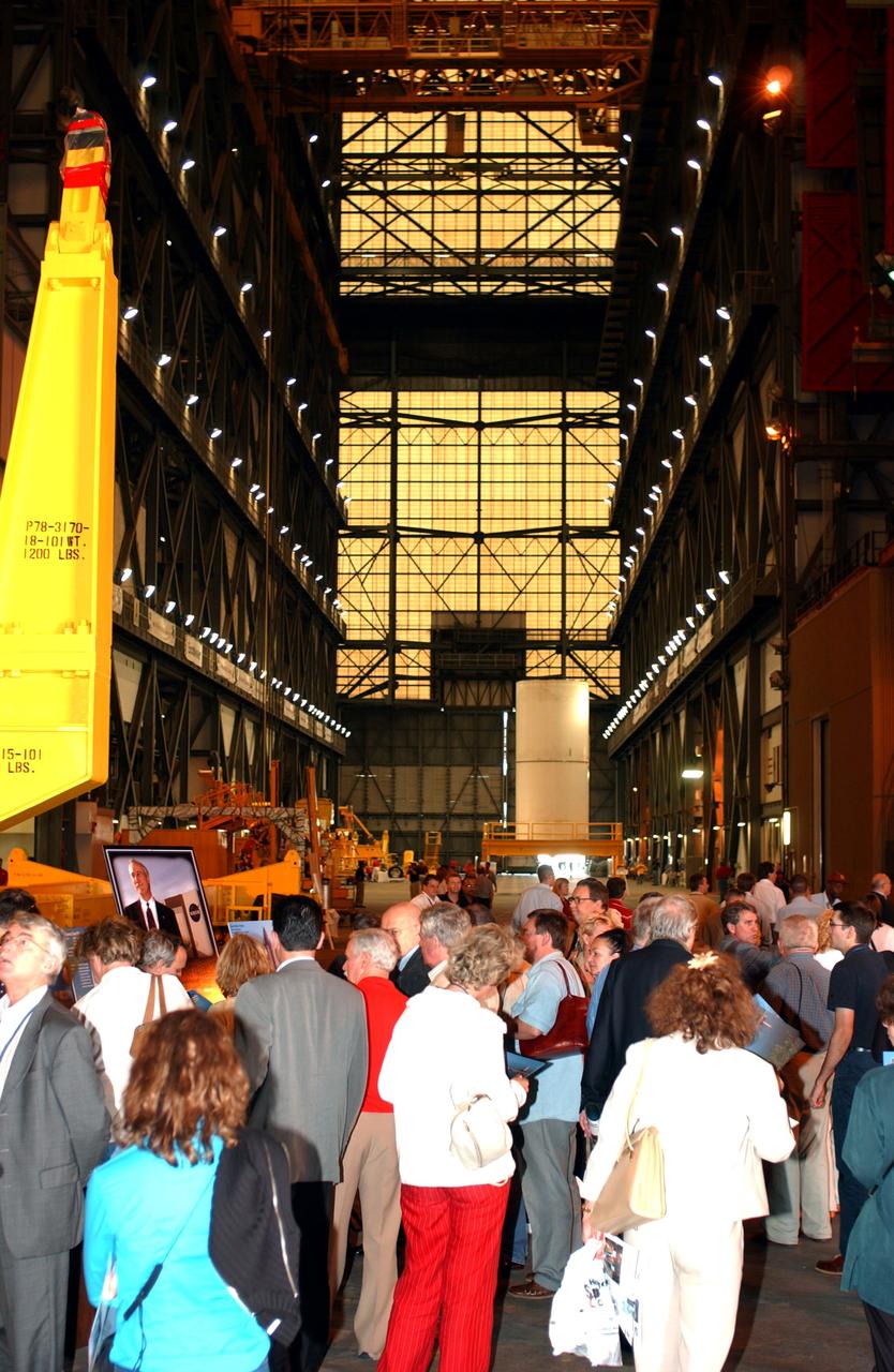KENNEDY SPACE CENTER, FLA. - Members of the North American Treaty Organization (NATO) Parliamentary Assembly visit the Vehicle Assembly Building during their tour of KSC. In the background is a segment of a solid rocket booster. The Parliamentarians are meeting in Orlando this year for their 49th annual gathering.  They chose to visit KSC with their families during their one-day excursion break from meetings.