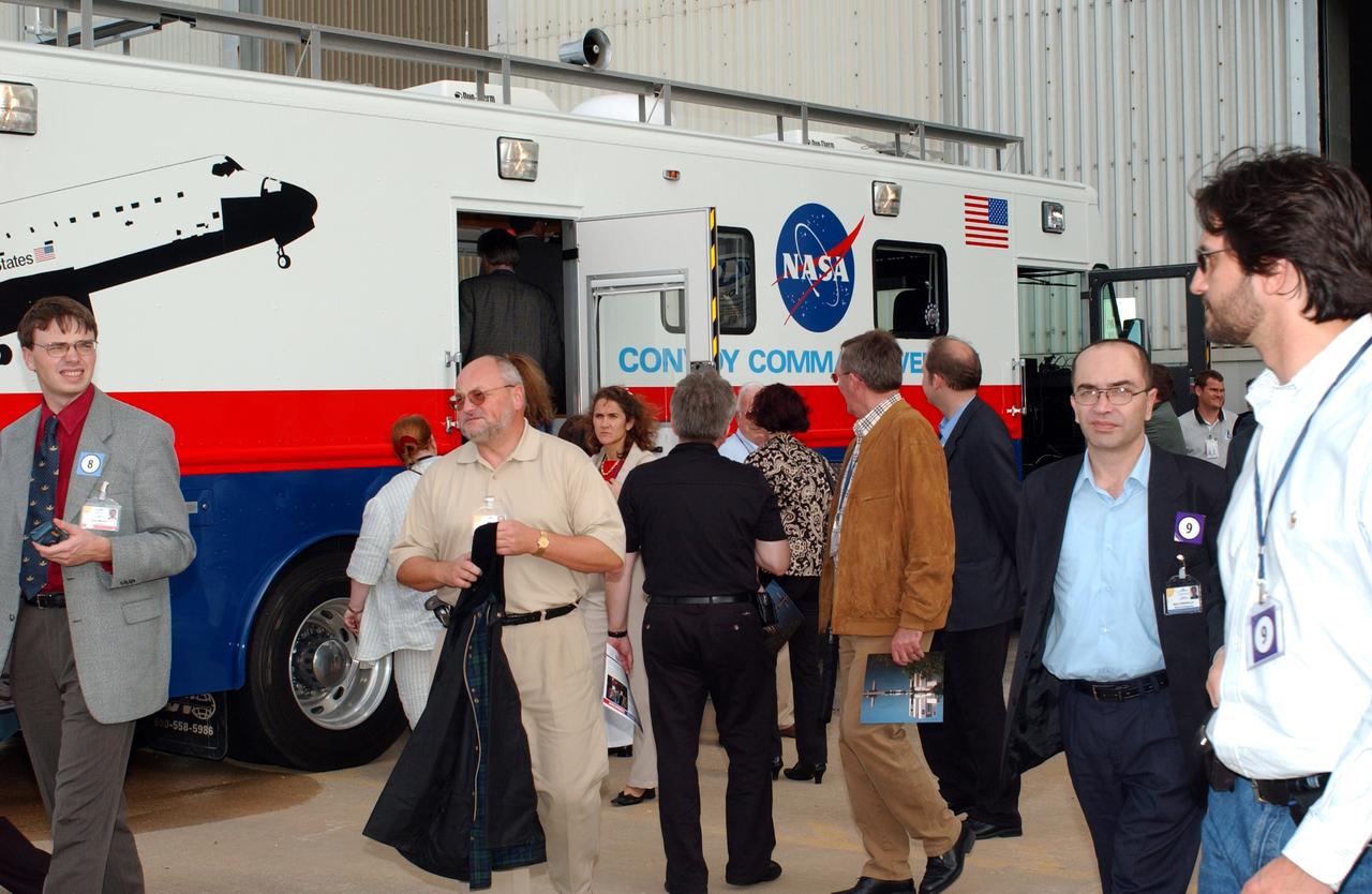 KENNEDY SPACE CENTER, FLA. - During their tour of KSC, members of the North American Treaty Organization (NATO) Parliamentary Assembly visit the Convoy Command Center, the prime vehicle to control critical communications between the orbiter, the crew and the Launch Control Center after a Shuttle landing, to monitor the health of the Shuttle Orbiter systems and to direct convoy operations at the Shuttle Landing Facility. The Parliamentarians are meeting in Orlando this year for their 49th annual gathering. They chose to visit KSC with their families during their one-day excursion break from meetings.