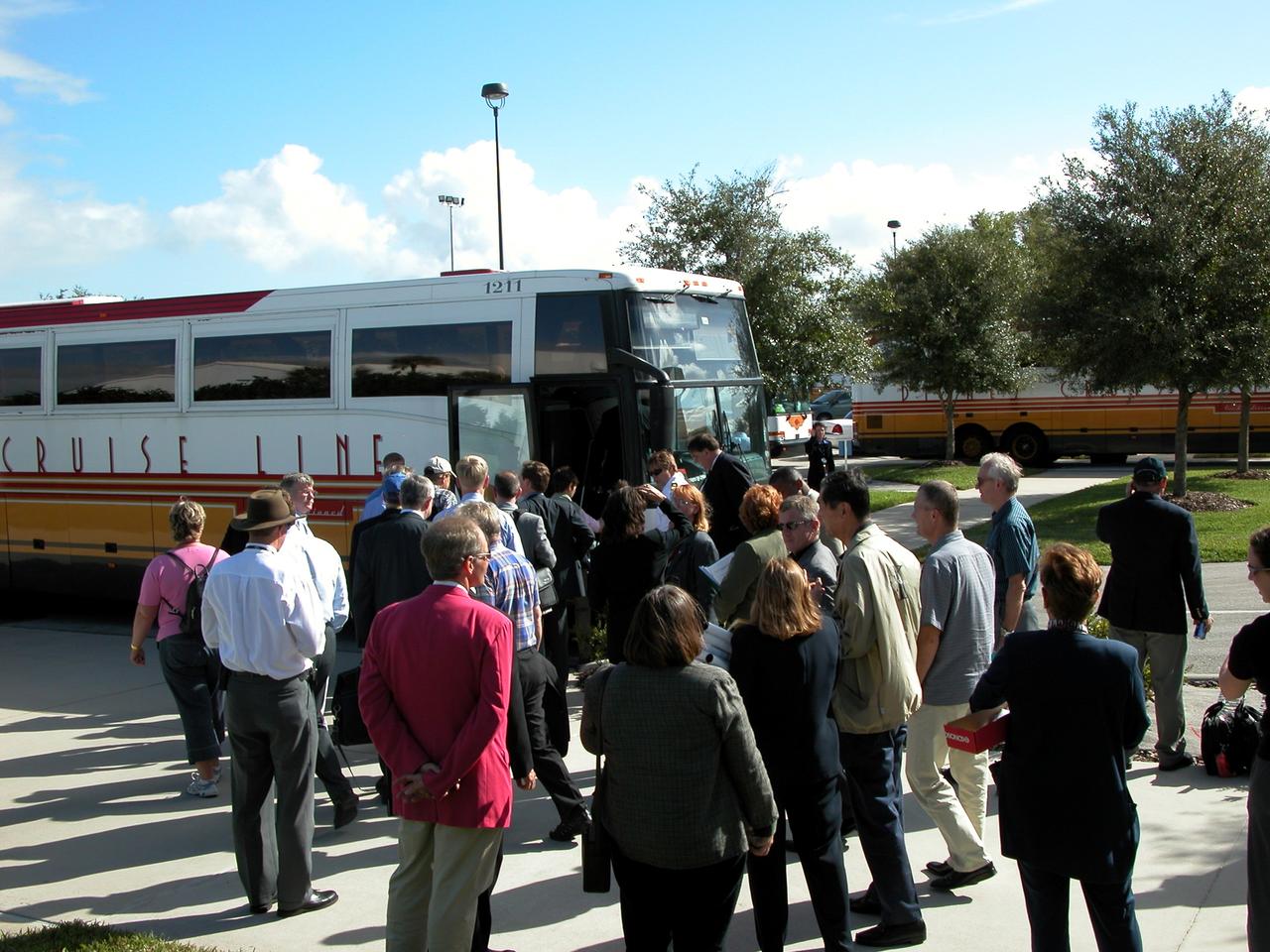 KENNEDY SPACE CENTER, FLA. - After their tour of KSC, members of the North American Treaty Organization (NATO) Parliamentary Assembly board their tour bus to return to Orlando.   The Parliamentarians are meeting in Orlando this year for their 49th annual gathering.  They chose to visit KSC with their families during their one-day excursion break from meetings.