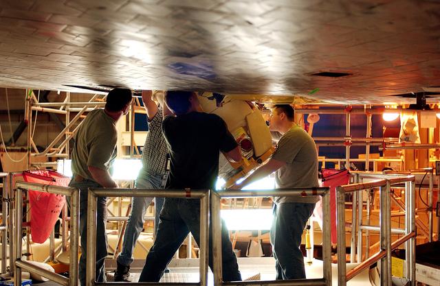 NASA image: KENNEDY SPACE CENTER, FLA. -  Workers in the Orbiter Processing Facility insert the liquid oxygen feedline for the 17-inch disconnect in the orbiter Discovery.  The 17-inch liquid oxygen and liquid hydrogen disconnects provide the propellant feed interface from the external tank to the orbiter main propulsion system and the three Shuttle main engines.