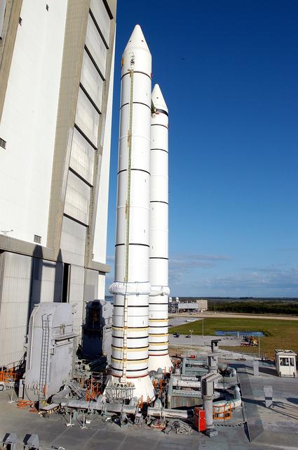 NASA image: KENNEDY SPACE CENTER, FLA. -  The crawler transporter has slowly moved the Mobile Launcher Platform (MLP), carrying a set of twin solid rocket boosters, out of the Vehicle Assembly Building (VAB) in support of engineering analysis vibration tests on the crawler and MLP. The crawler is moving at various speeds up to 1 mph in an effort to achieve vibration data gathering goals as it leaves the VAB and then returns.  The boosters are braced at the top for stability.  The primary purpose of these rollout tests is to gather data to develop future maintenance requirements on the transport equipment and the flight hardware. Various parts of the MLP and crawler transporter have been instrumented with vibration data collection equipment.