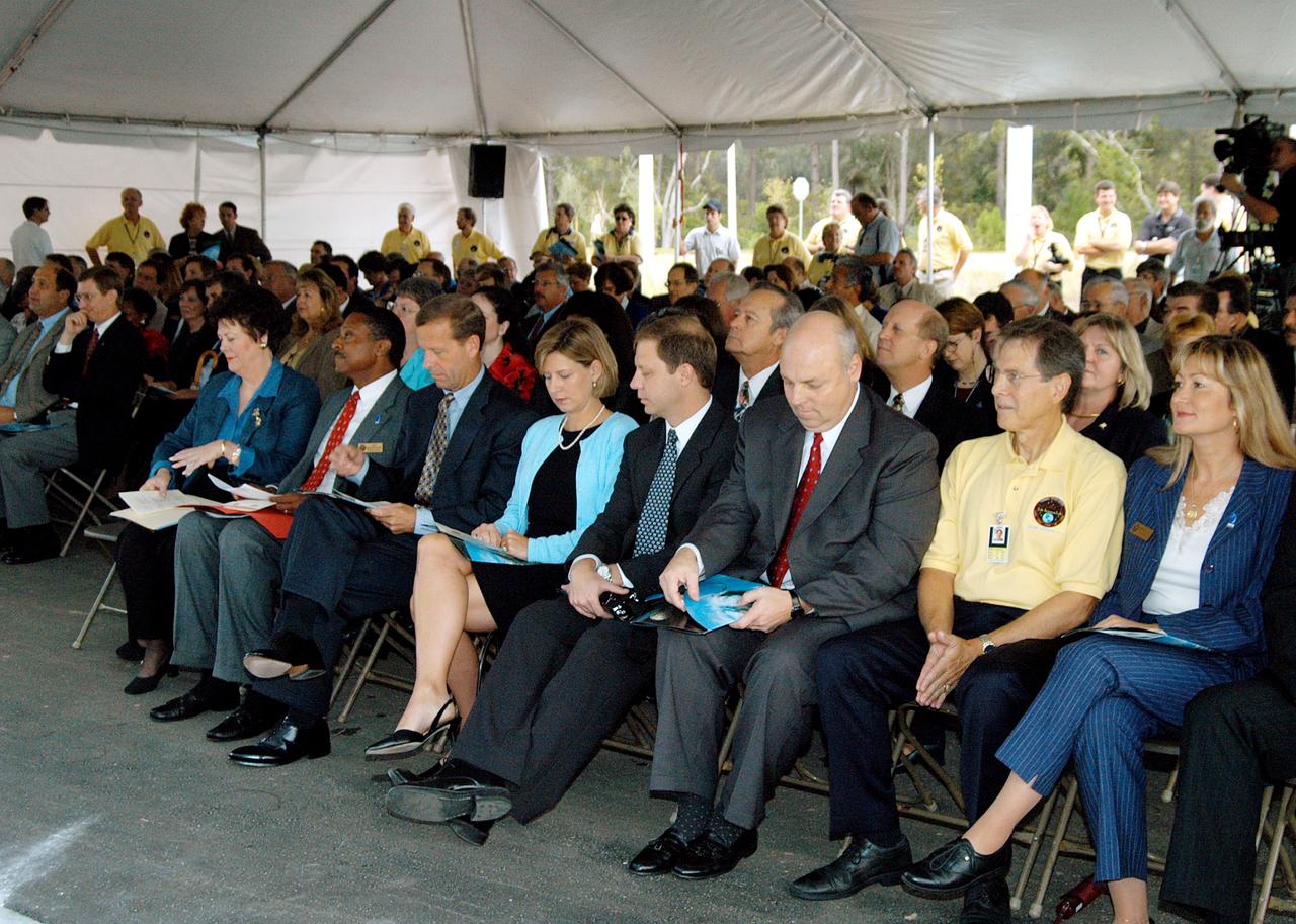 KENNEDY SPACE CENTER, FLA. -  Dignitaries, invited guests, space center employees, and the media gather for a dedication and ribbon-cutting ceremony for the Space Life Sciences Lab hosted by NASA-Kennedy Space Center and the state of Florida at the new lab. Completed in August, the facility encompasses more than 100,000 square feet and was formerly known as the Space Experiment Research and Processing Laboratory or SERPL. The state, through the Florida Space Authority, built the research lab which is host to NASA, NASA’s Life Sciences Services contractor Dynamac Corp., Bionetics Corp., and researchers from the University of Florida.  Dynamac Corp. leases the facility.  The Florida Space Research Institute is responsible for gaining additional tenants from outside the NASA community.