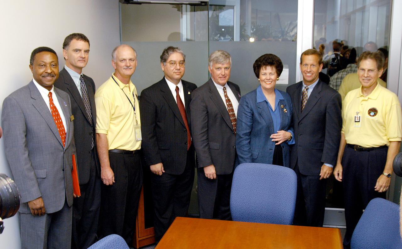 KENNEDY SPACE CENTER, FLA. -  Officials of the NASA-Kennedy Space Center and the state of Florida pose for a group portrait at a dedication and ribbon-cutting ceremony for the Space Life Sciences Lab at the new lab. From left are Capt. Winston Scott, executive director of the Florida Space Authority; Dr. Robert J. Ferl, director of Space Agriculture Biotechnology Research and Education (SABRE), University of Florida; Charlie Quincy, chief of the Biological Sciences Office, Kennedy Space Center; Jose Perez-Morales, NASA Project Manager for the Space Life Sciences Lab; Jim Kennedy, director of the Kennedy Space Center; The Honorable Toni Jennings, lieutenant governor of the state of Florida; Frank T. Brogan, president of the Florida Atlantic University; and Dr. Samuel Durrance, executive director of the Florida Space Research Institute.  Completed in August, the facility encompasses more than 100,000 square feet and was formerly known as the Space Experiment Research and Processing Laboratory or SERPL. The state, through the Florida Space Authority, built the research lab which is host to NASA, NASA’s Life Sciences Services contractor Dynamac Corp., Bionetics Corp., and researchers from the University of Florida.  Dynamac Corp. leases the facility.  The Florida Space Research Institute is responsible for gaining additional tenants from outside the NASA community.