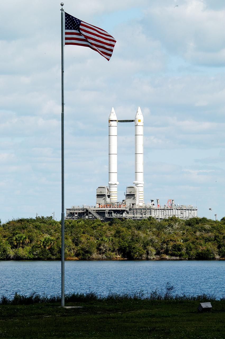 KENNEDY SPACE CENTER, FLA. -  Mobile Launcher Platform (MLP) number 3 and a set of twin solid rocket boosters bolted to it, atop the crawler-transporter, inches along the crawlerway in support of the second engineering analysis vibration test on the crawler and MLP.  The MLP is viewed from the KSC News Center across the turn basin.  The crawler is moving at various speeds up to 1 mph in an effort to achieve vibration data gathering goals as it leaves the VAB, travels toward Launch Pad 39A and then returns.  The boosters are braced at the top for stability.  The primary purpose of these rollout tests is to gather data to develop future maintenance requirements on the transport equipment and the flight hardware. Various parts of the MLP and crawler transporter have been instrumented with vibration data collection equipment.