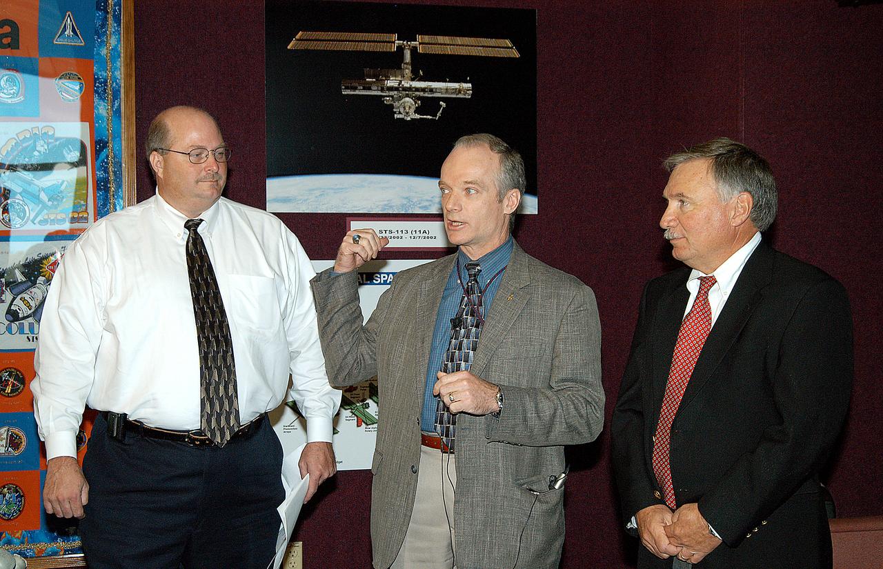 In the Space Station Processing Facility, (from left) David Bethay, Boeing/ISS Florida Operations; Charlie Precourt, deputy manager of the International Space Station Program; and Tip Talone, director of Space Station and Payload Processing, give an overview of Space Station processing for the media. Members of the media were invited to commemorate the fifth anniversary of the launch of the first element of the International Space Station by touring the Space Station Processing Facility (SSPF) at KSC. Reporters also had the opportunity to see Space Station hardware that is being processed for deployment once the Space Shuttles return to flight. The facility tour also included an opportunity for reporters to talk with NASA and Boeing mission managers about the various hardware elements currently being processed for flight.
