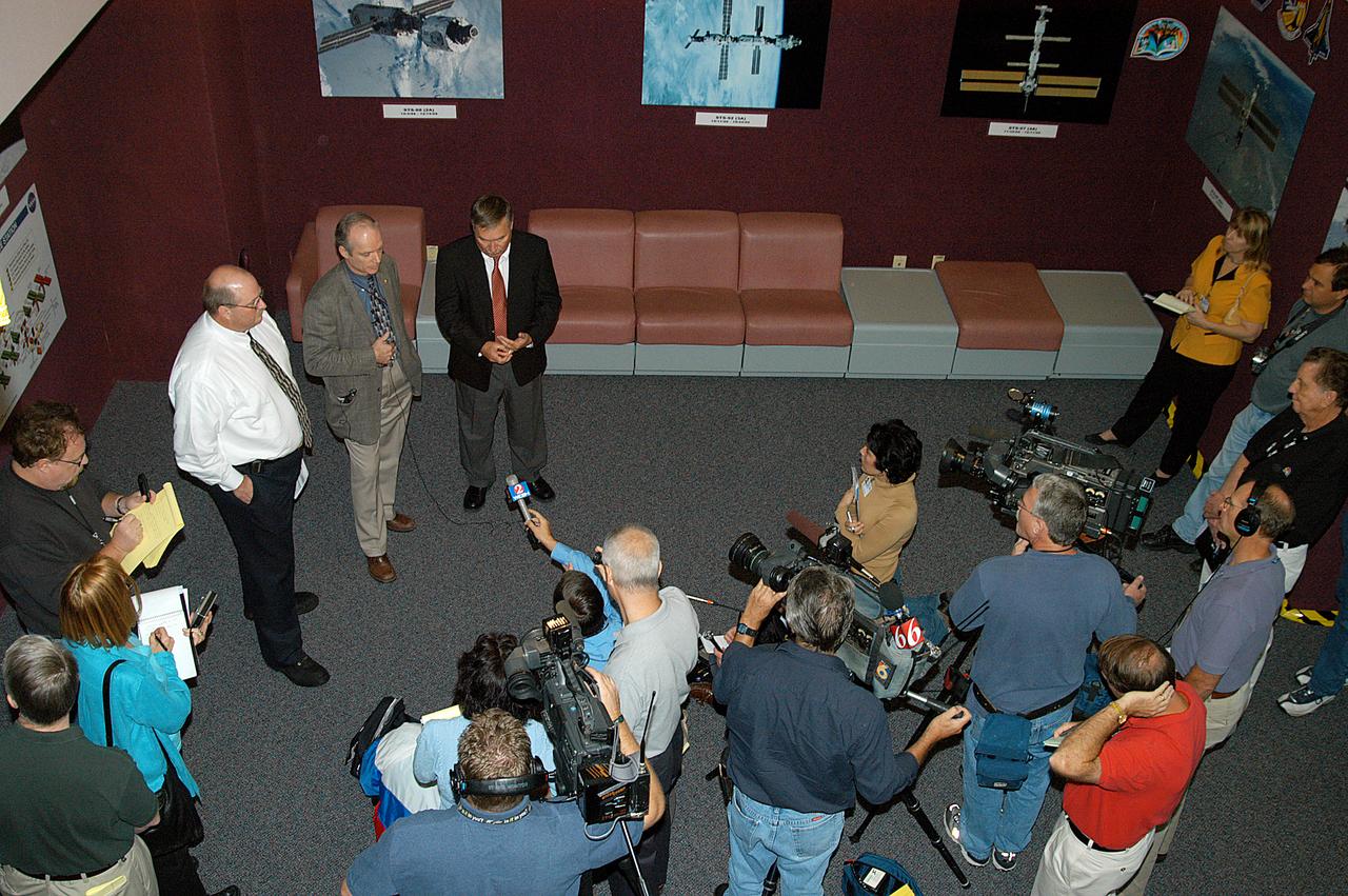 Members of the media (at right) were invited to commemorate the fifth anniversary of the launch of the International Space Station by touring the Space Station Processing Facility (SSPF) at KSC. Giving an overview of Space Station processing are, at left, David Bethay (white shirt), Boeing/ISS Florida Operations; Charlie Precourt, deputy manager of the International Space Station Program; and Tip Talone, director of Space Station and Payload Processing at KSC. Reporters also had the opportunity to see Space Station hardware that is being processed for deployment once the Space Shuttles return to flight. The facility tour also included an opportunity for reporters to talk with NASA and Boeing mission managers about the various hardware elements currently being processed for flight.