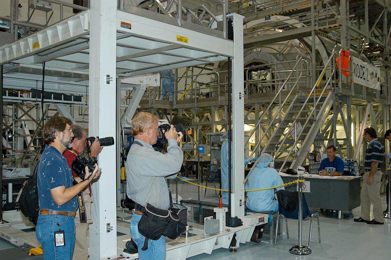 The Node 2 and other hardware undergoing processing for transport to the International Space Station are made available to photographers in the Space Station Processing Facility (SSPF). Members of the media were invited to commemorate the fifth anniversary of the launch of the first element of the International Space Station by touring the SSPF. Reporters had the opportunity to see Space Station hardware that is being processed for deployment once the Space Shuttles return to flight, as well as talk with NASA and Boeing mission managers about the various hardware elements currently being processed for flight.