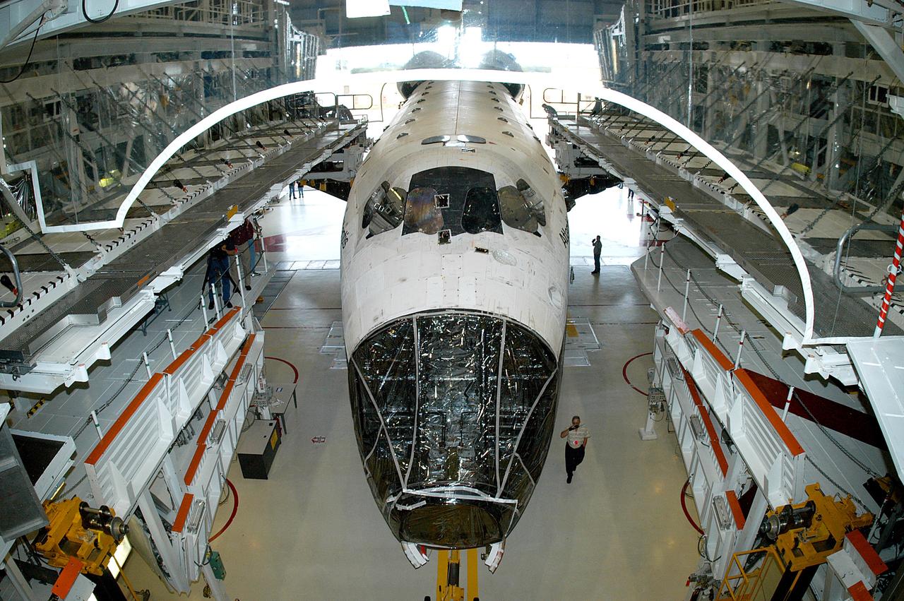KENNEDY SPACE CENTER, FLA. - The Space Shuttle orbiter Atlantis is moments away from a tow from the Orbiter Processing Facility (OPF) to the Vehicle Assembly Building (VAB). The move will allow work to be performed in the OPF that can only be accomplished while the bay is empty. Work scheduled in the processing facility includes annual validation of the bay's cranes, work platforms, lifting mechanisms, and jack stands. Atlantis will remain in the VAB for about 10 days, then return to the OPF as work resumes to prepare it for launch in September 2004 on the first return-to-flight mission, STS-114.