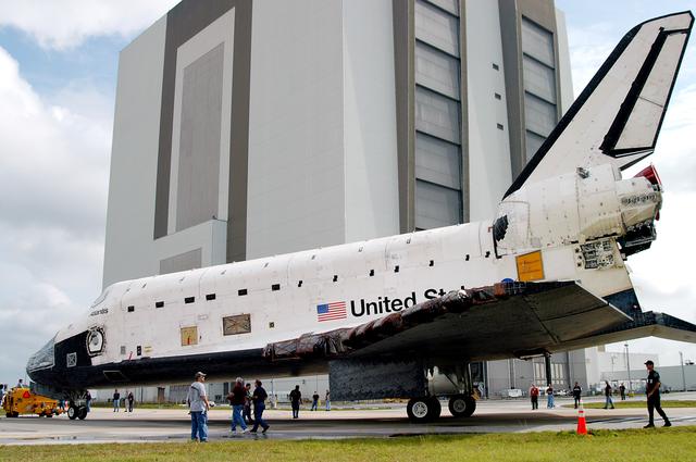 KENNEDY SPACE CENTER, FLA. - The Space Shuttle orbiter Atlantis approaches the Vehicle Assembly Building (VAB).  It is being towed from the Orbiter Processing Facility (OPF) to allow work to be performed in the bay that can only be accomplished while it is empty. Work scheduled in the processing facility includes annual validation of the bay's cranes, work platforms, lifting mechanisms, and jack stands. Atlantis will remain in the VAB for about 10 days, then return to the OPF as work resumes to prepare it for launch in September 2004 on the first return-to-flight mission, STS-114.